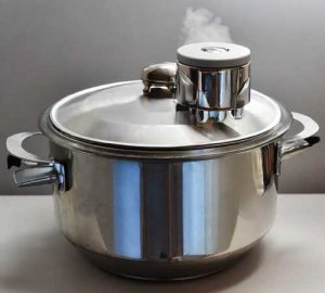 A pressure cooker, which is a common device for steam sterilization.